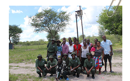 Bamunu Conservancy members and game guards standing next to their electricity transformer